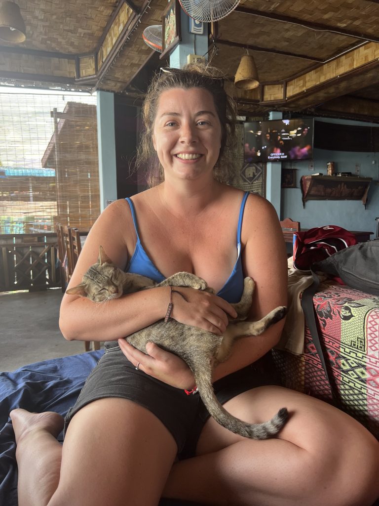 Cuddling one of the many friendly cats on Don Det